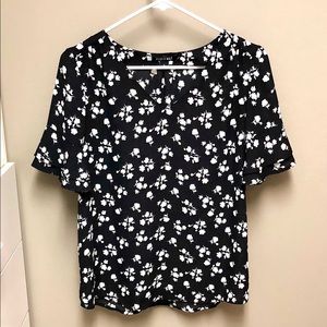 Black blouse with white floral detail